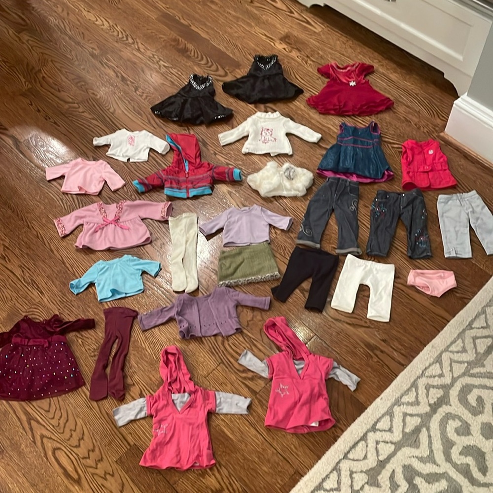 A ton of barely used American Girl Doll clothes!!!